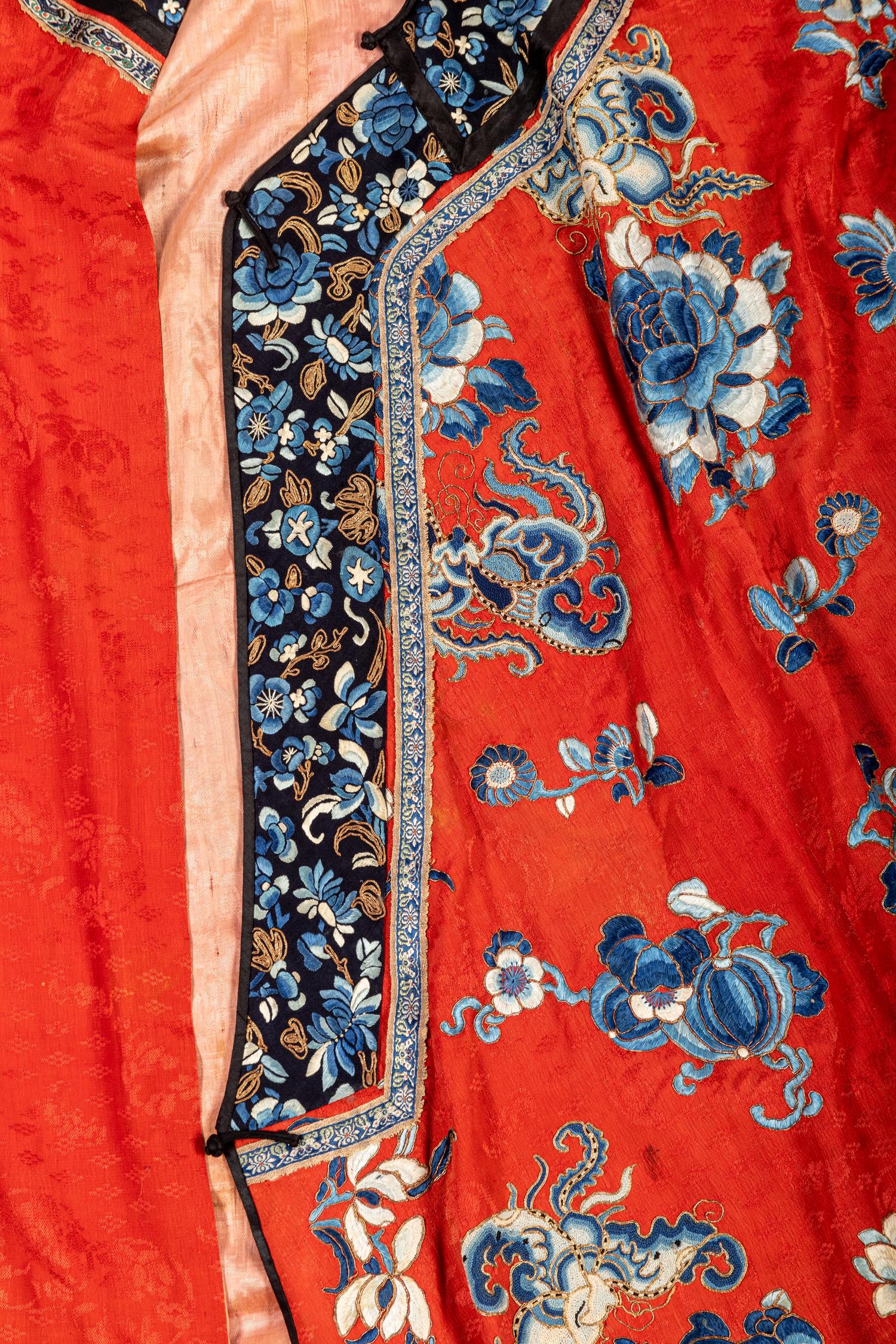 A Chinese Red Ground Embroidered Silk Lady's Robe