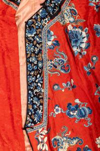 A Chinese Red Ground Embroidered Silk Lady's Robe
