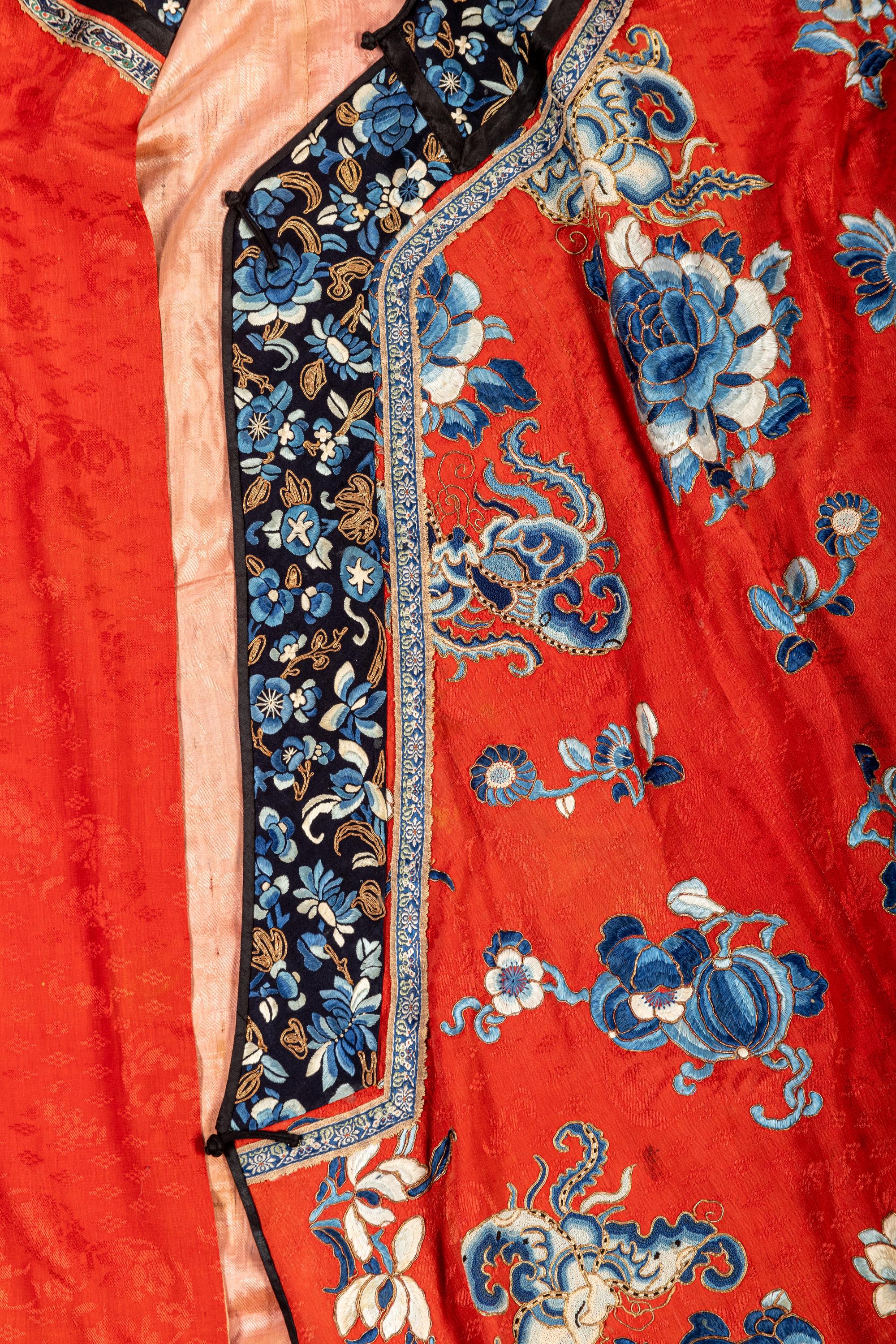 A Chinese Red Ground Embroidered Silk Lady's Robe