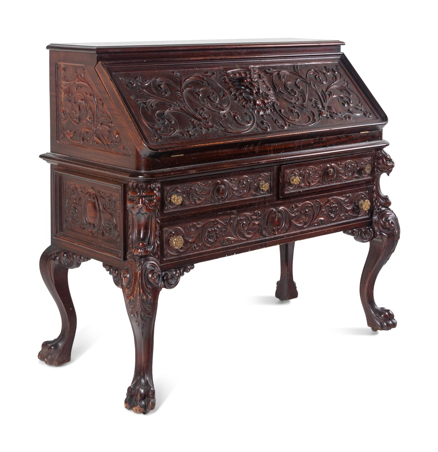 A Renaissance Revival Carved Mahogany Slant-Front Bureau
