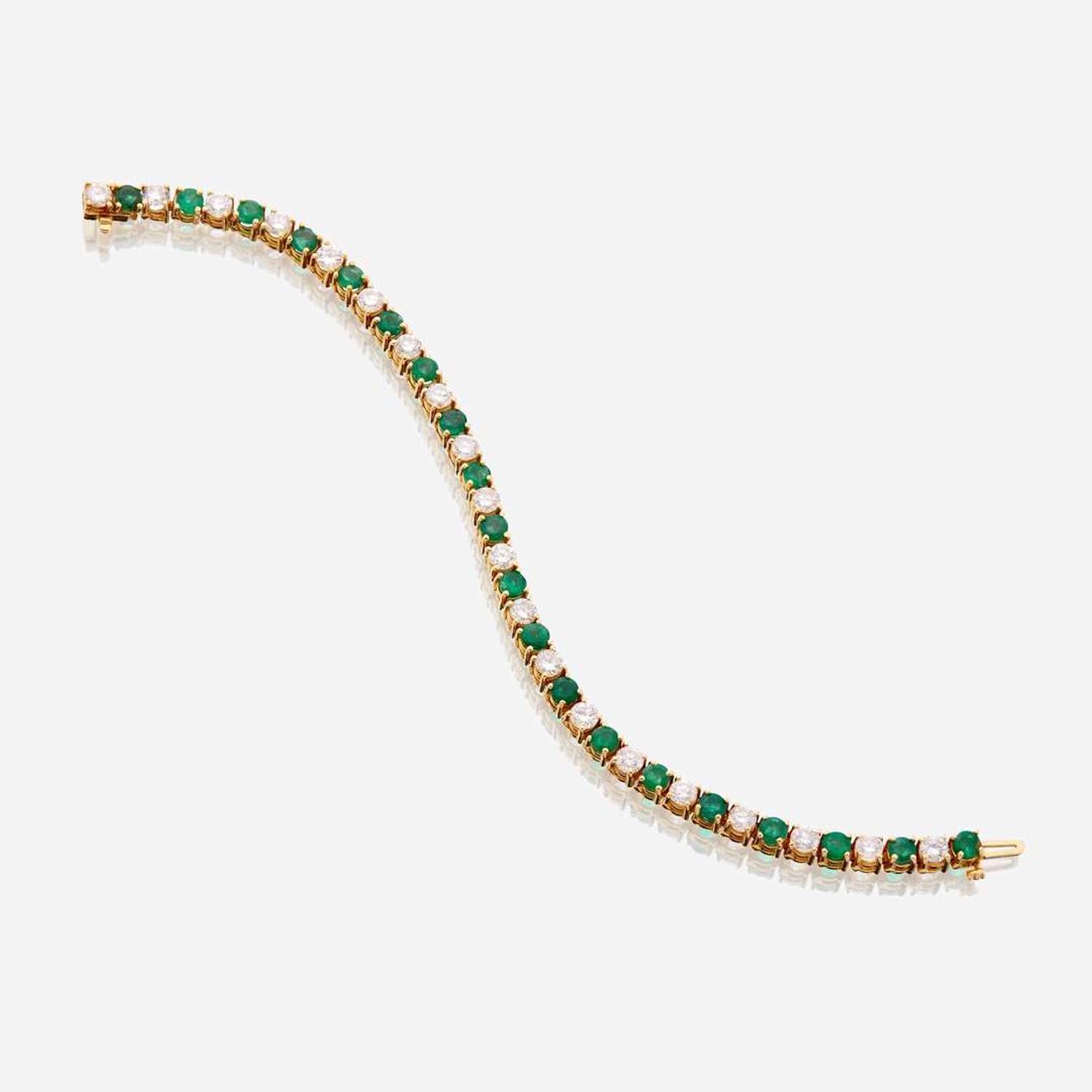 A diamond, emerald, and fourteen karat gold bracelet