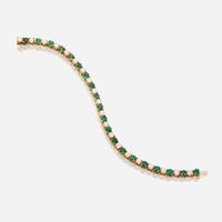 A diamond, emerald, and fourteen karat gold bracelet
