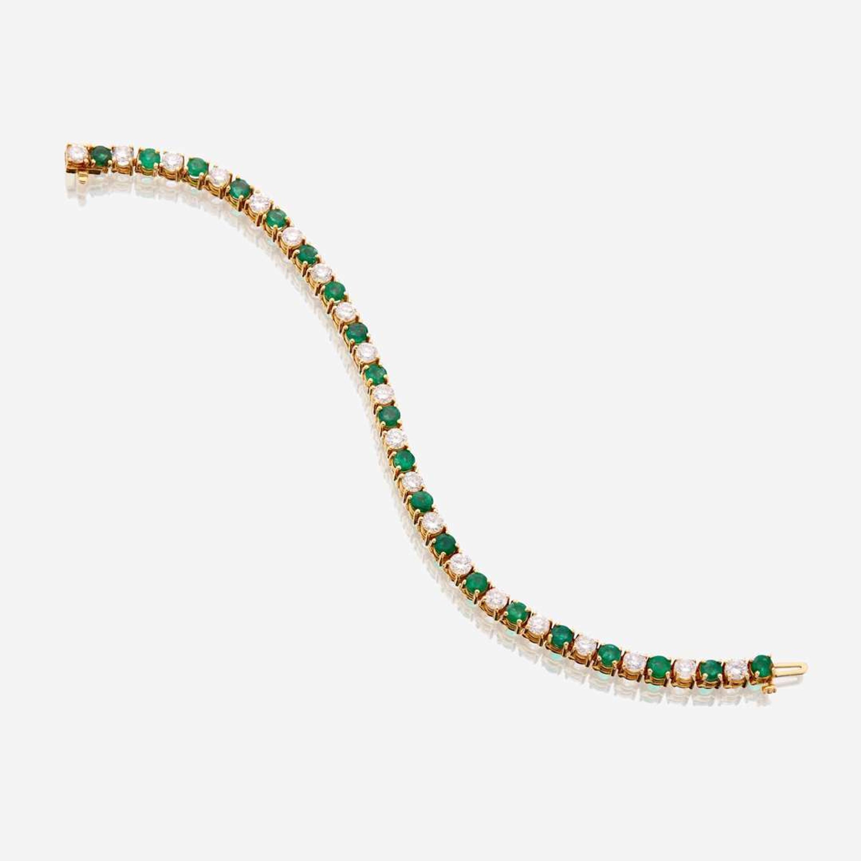 A diamond, emerald, and fourteen karat gold bracelet