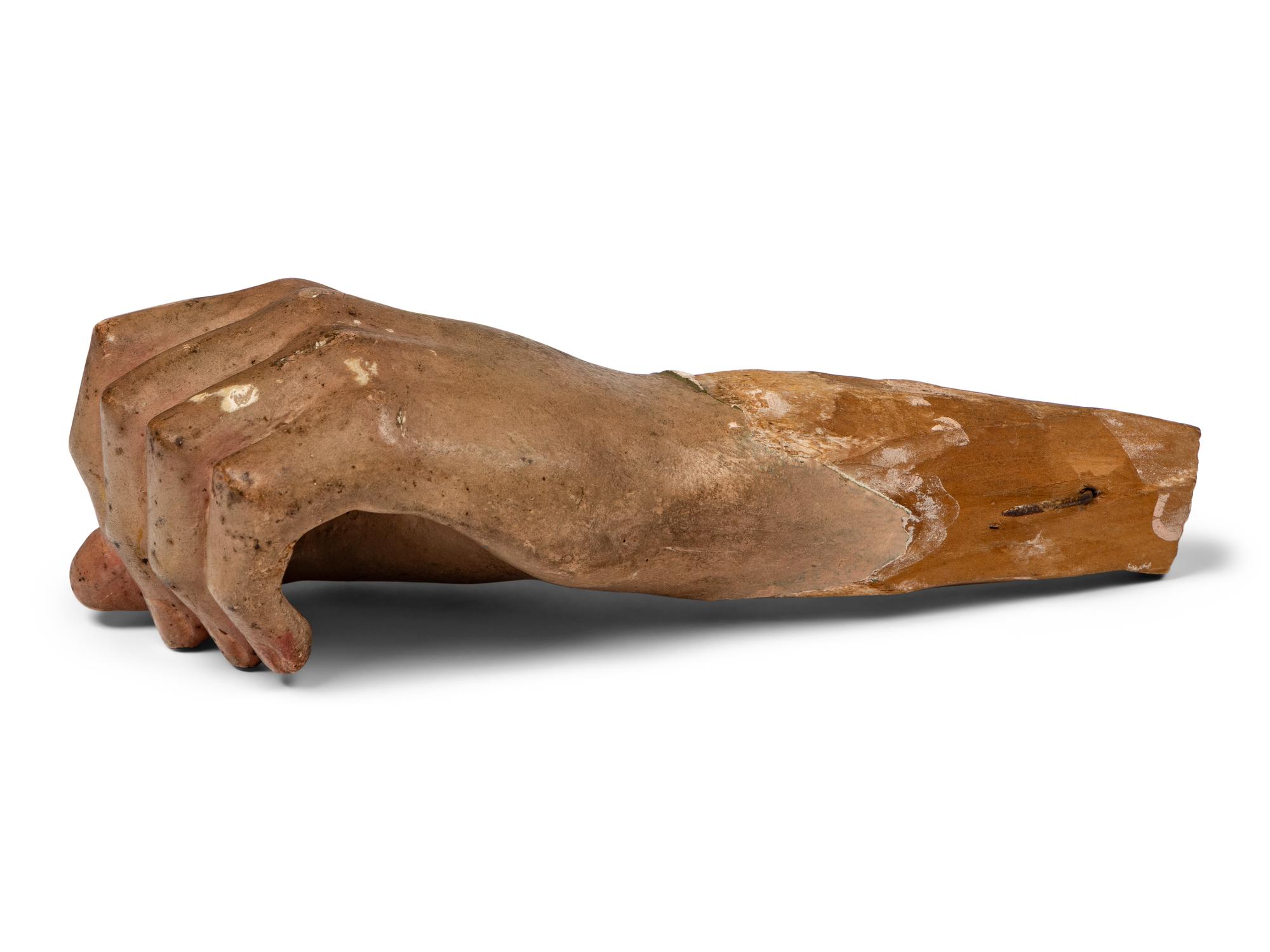 A Carved and Painted Wood Fragment of a Hand