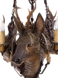 A Black Forest Style Composite Three-Light Chandelier