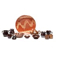 A Pennsylvania Redware Plate and Collection of Miniature Stoneware