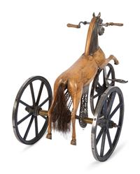 A Carved Wood and Cast Metal Tricycle