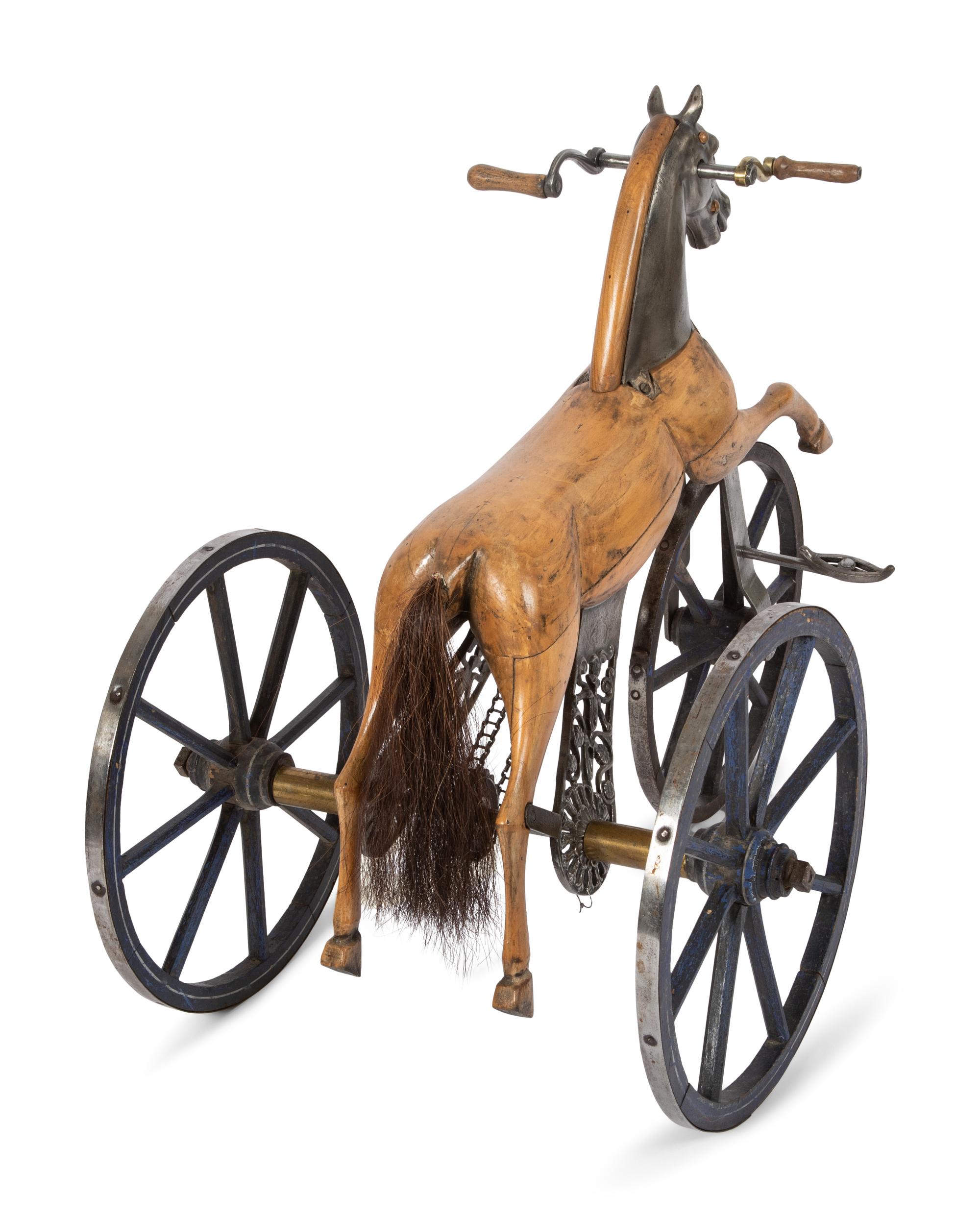 A Carved Wood and Cast Metal Tricycle