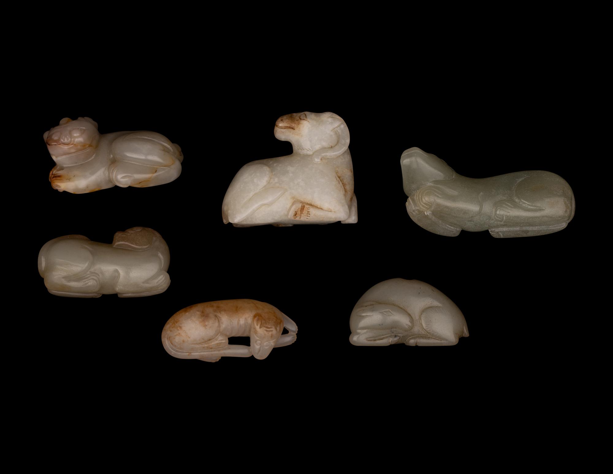 Six Chinese Carved Celadon Jade Figures of Recumbent Animals