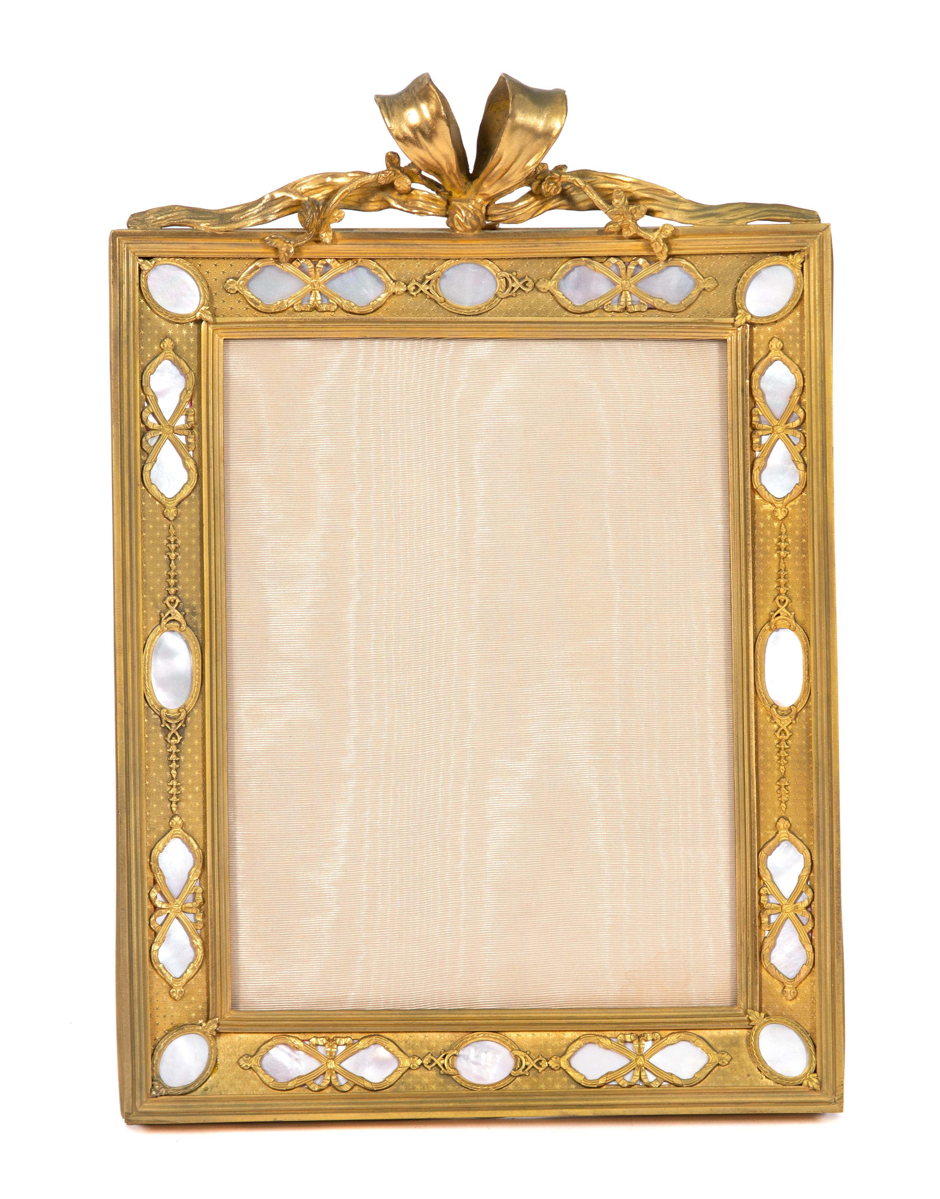 A French Gilt Bronze and Mother-of-Pearl Inset Easel Back Frame Height 14 1/2 x width 10 inches. — 19TH CENTURY