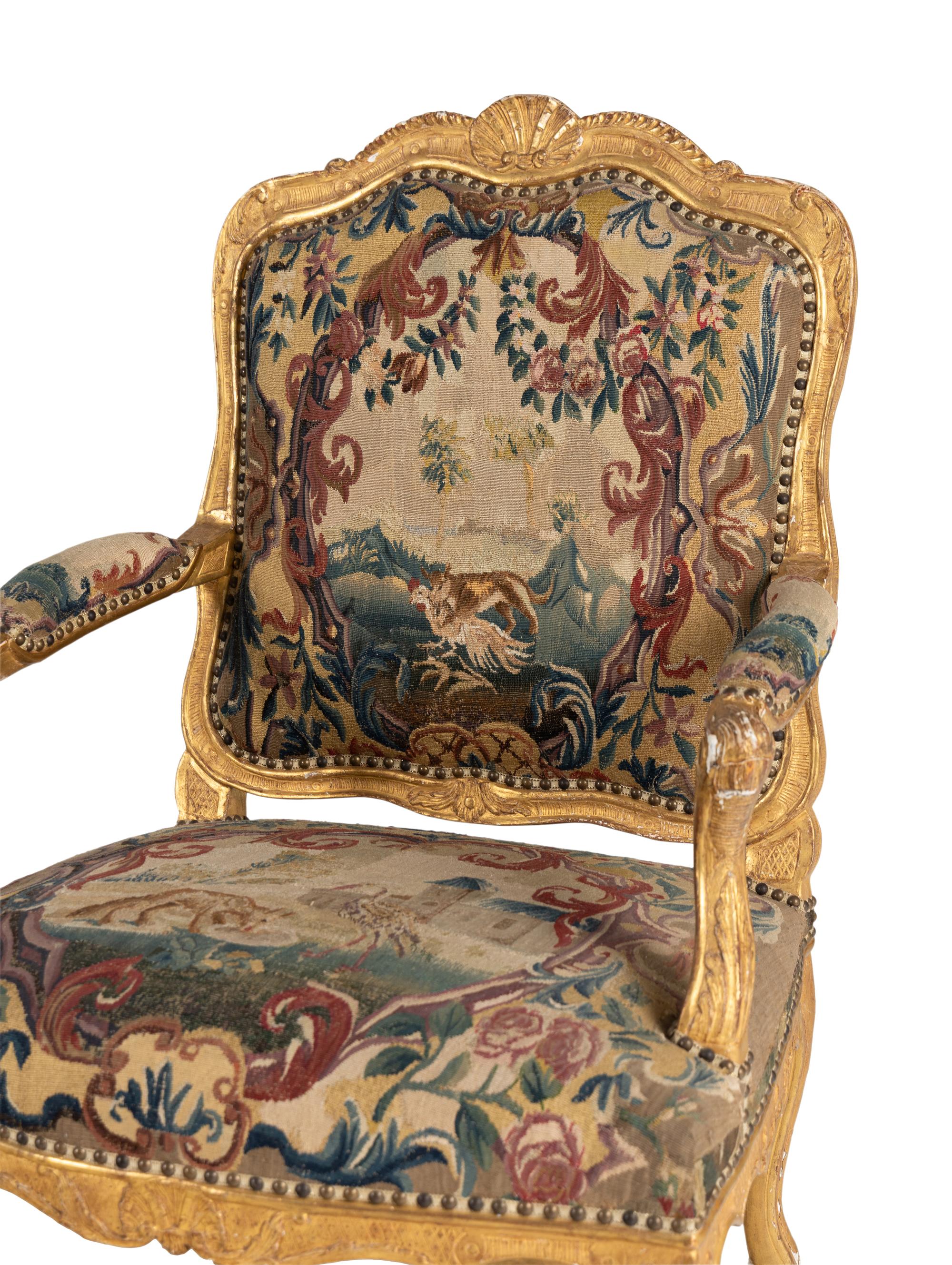 A Pair of Régence Tapestry-Upholstered Giltwood Fauteuils