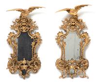 A Pair of George II Style Carved Giltwood Two-Light Mirrored Sconces Height 31 1/2 inches.