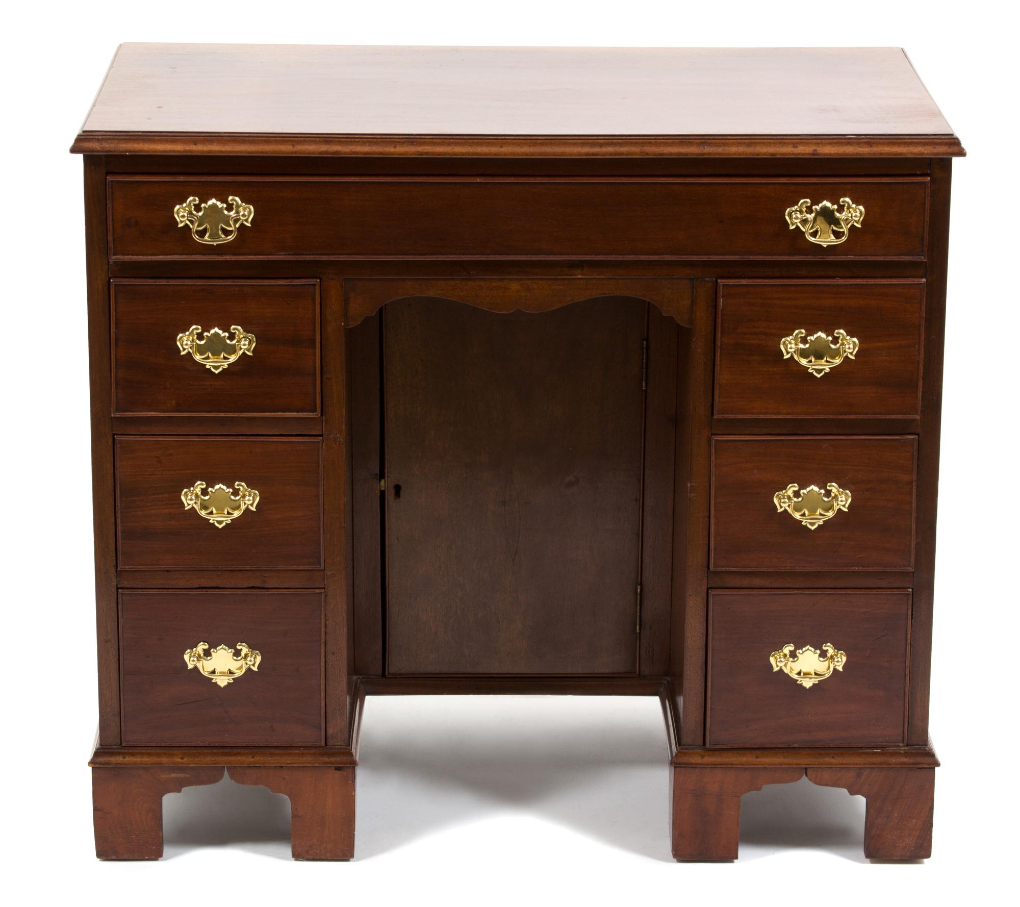 A Chippendale Style Mahogany Kneehole Desk Height 29 1/2 x width 31 1/2 x depth 18 3/4 inches. — FIRST HALF 20TH CENTURY