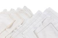 A Large Group of White Table Linens