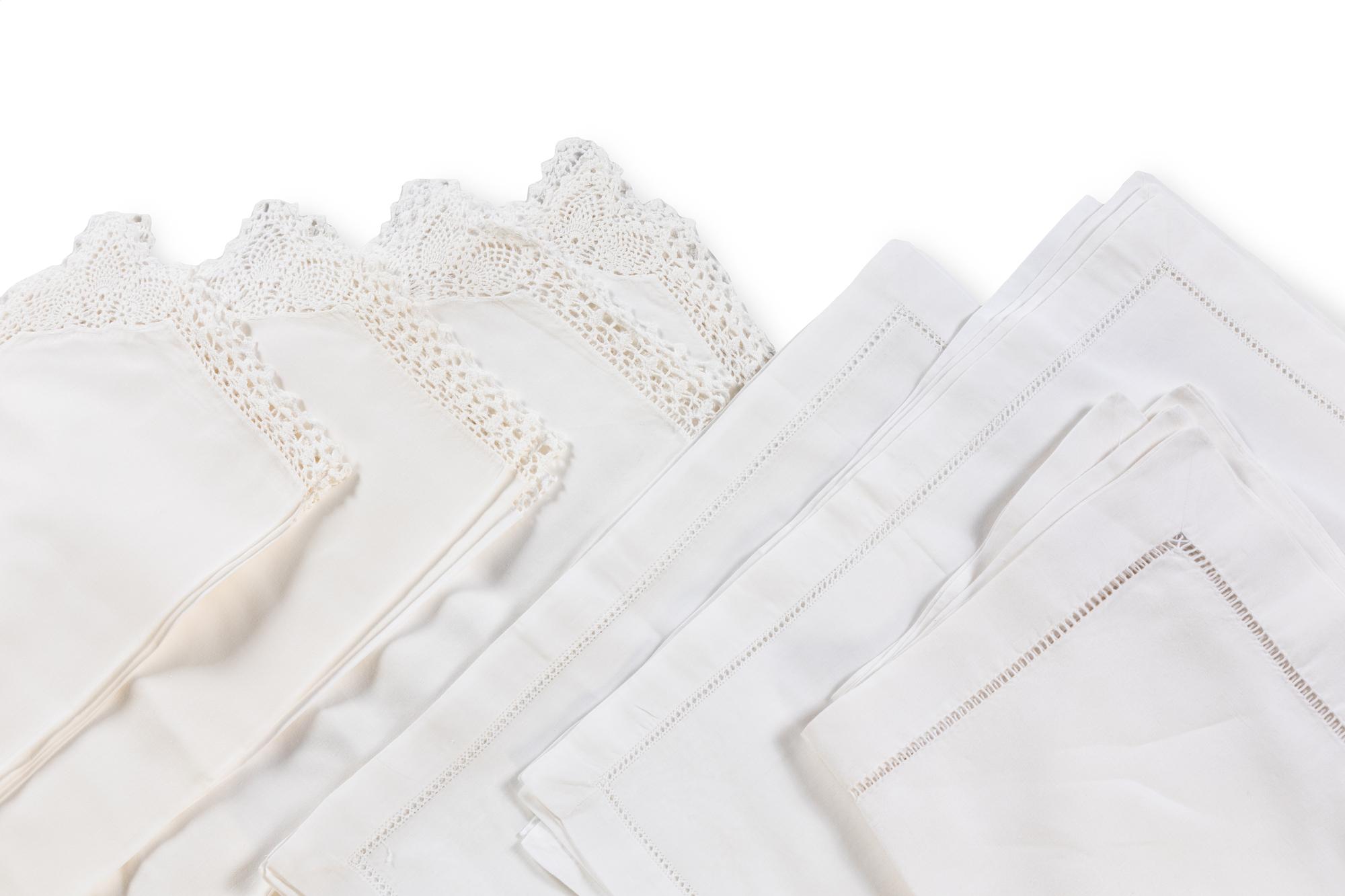 A Large Group of White Table Linens