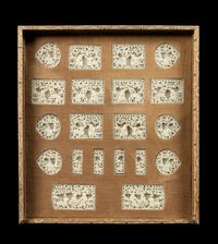 A Set of Twenty Pale-Celadon Jade Belt Ornaments Length of largest 2 inches.