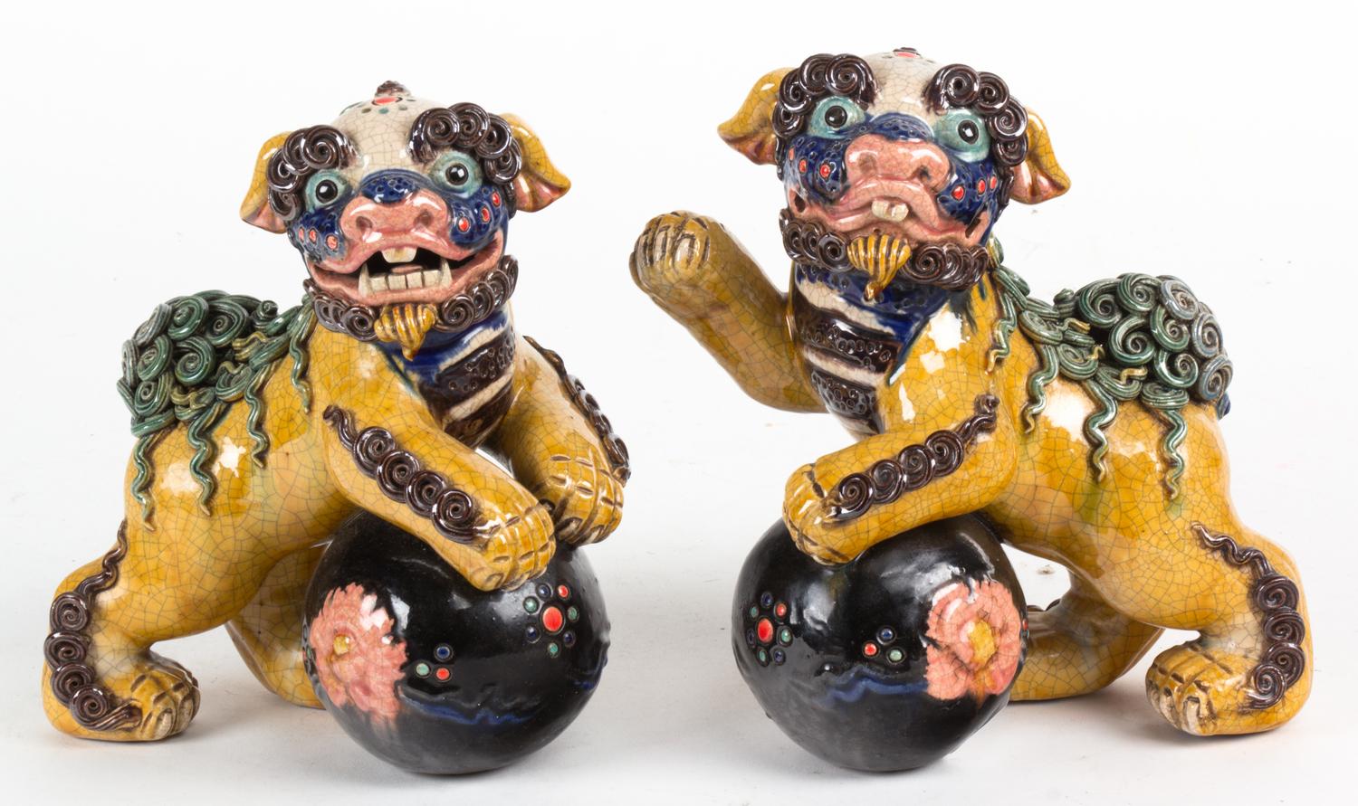 A Pair of Chinese Ceramic Foo Dogs Height 7 3/4 inches.