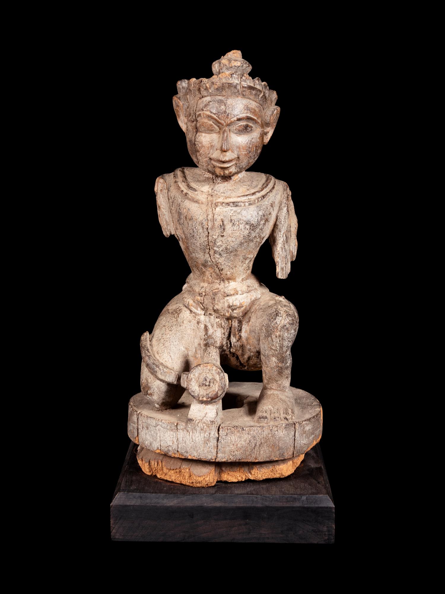 An Indian Carved Wood Figure of a Deity