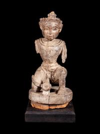 An Indian Carved Wood Figure of a Deity