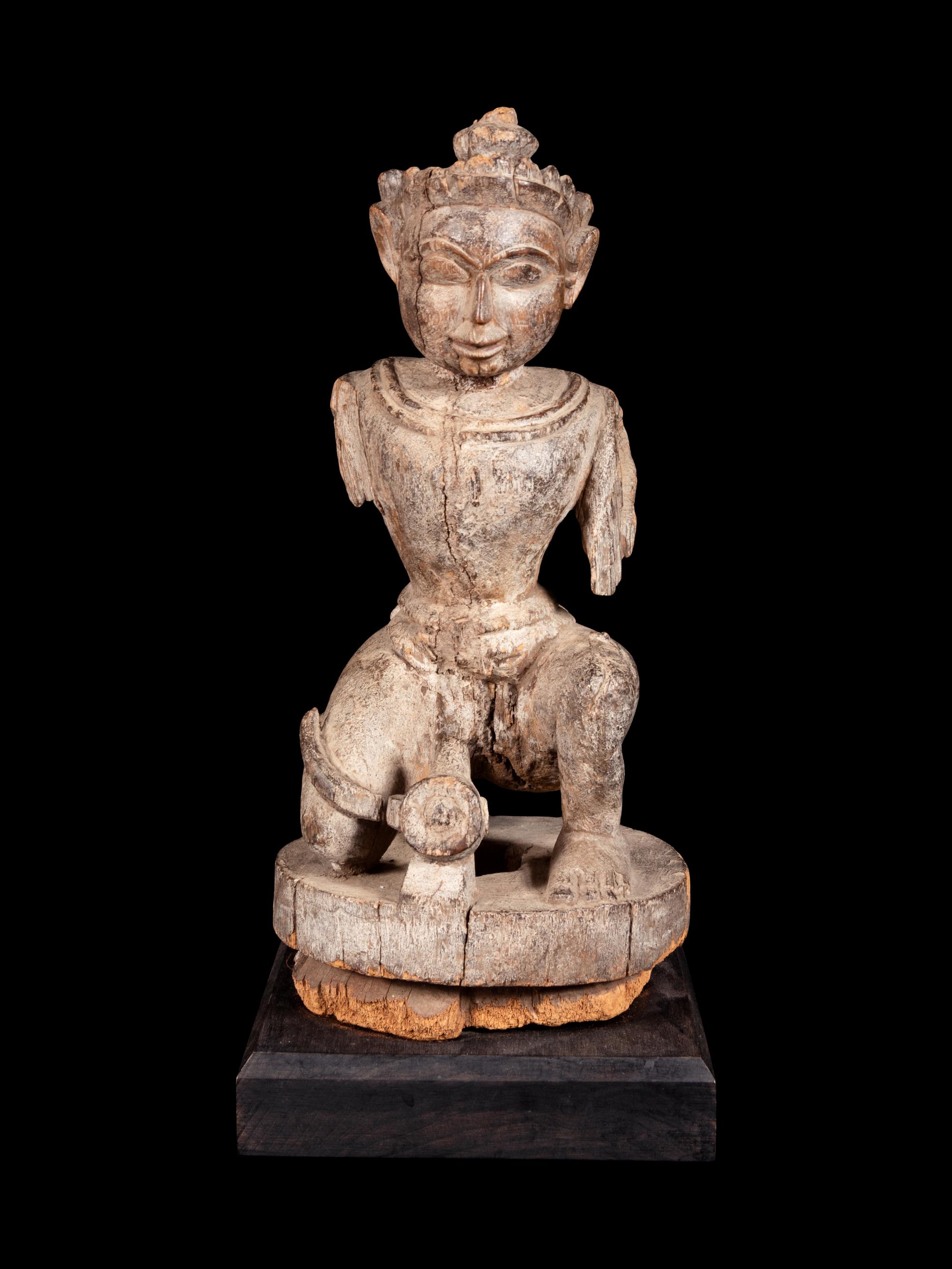 An Indian Carved Wood Figure of a Deity