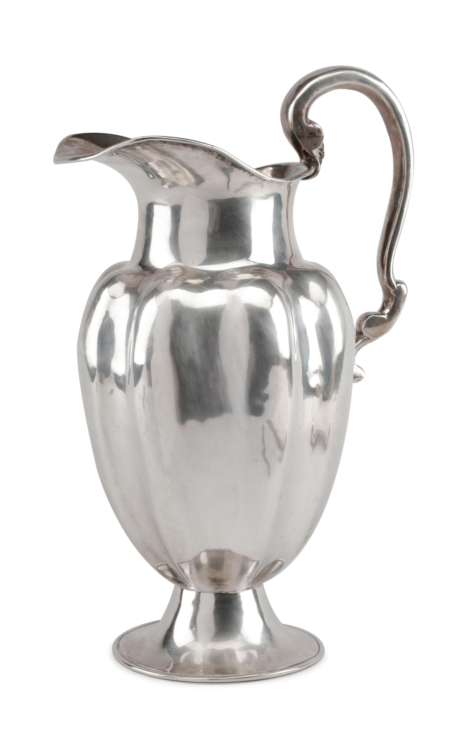 A Mexican Silver Water Pitcher, Conquistador S.A., Mexico City, 20th Century, of lobed baluster form, raised on a trumpet base.