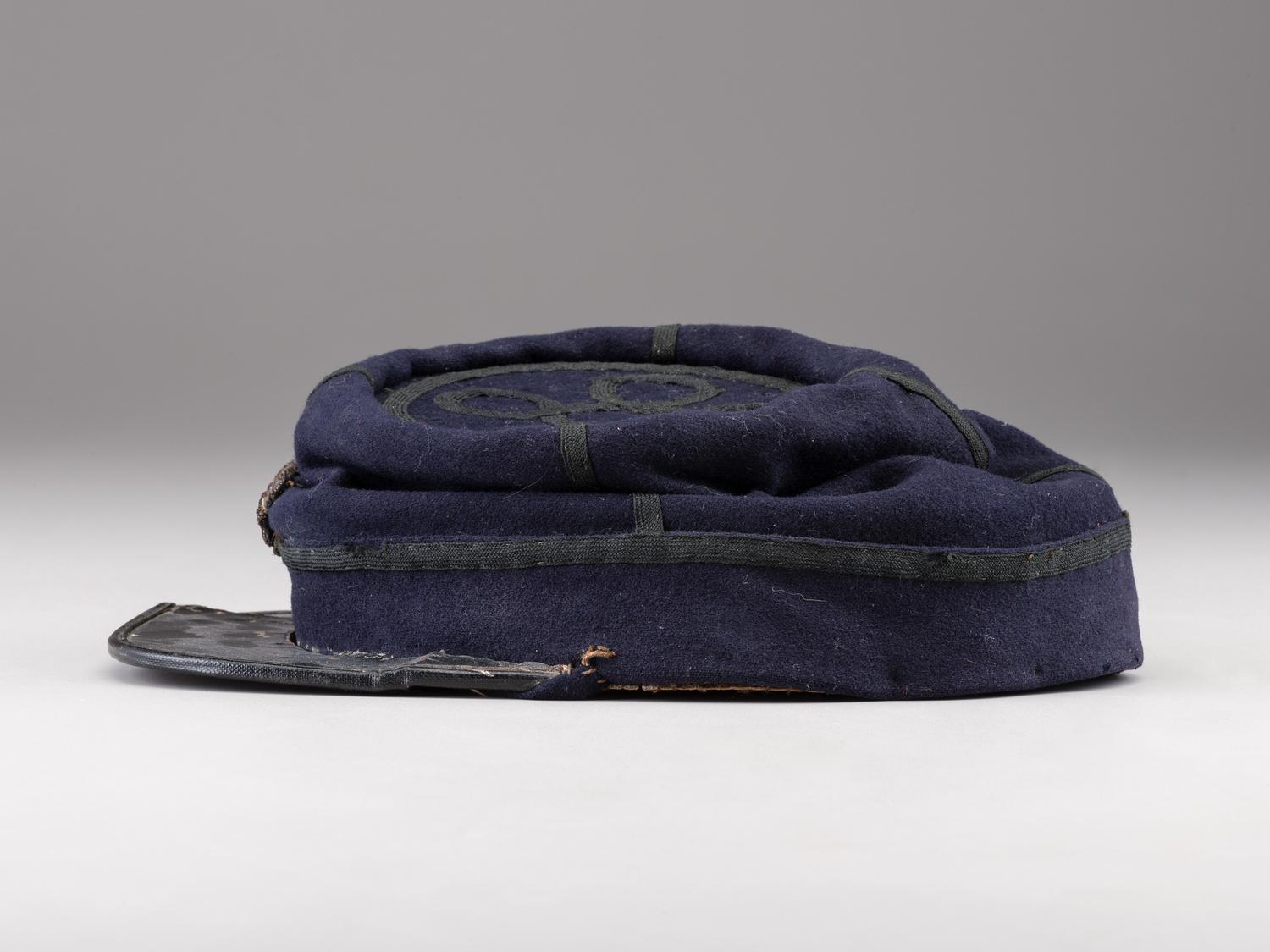 [CIVIL WAR]. Private purchase officer's sack coat, kepi, and carpet bag identified to Lieutenant Albert C. Sparks, Co. B, 37th Massachusetts Volunteers.