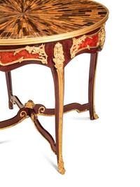 A Pair of Louis XV Style Gilt Bronze Mounted Tables with Tiger's Eye Tops