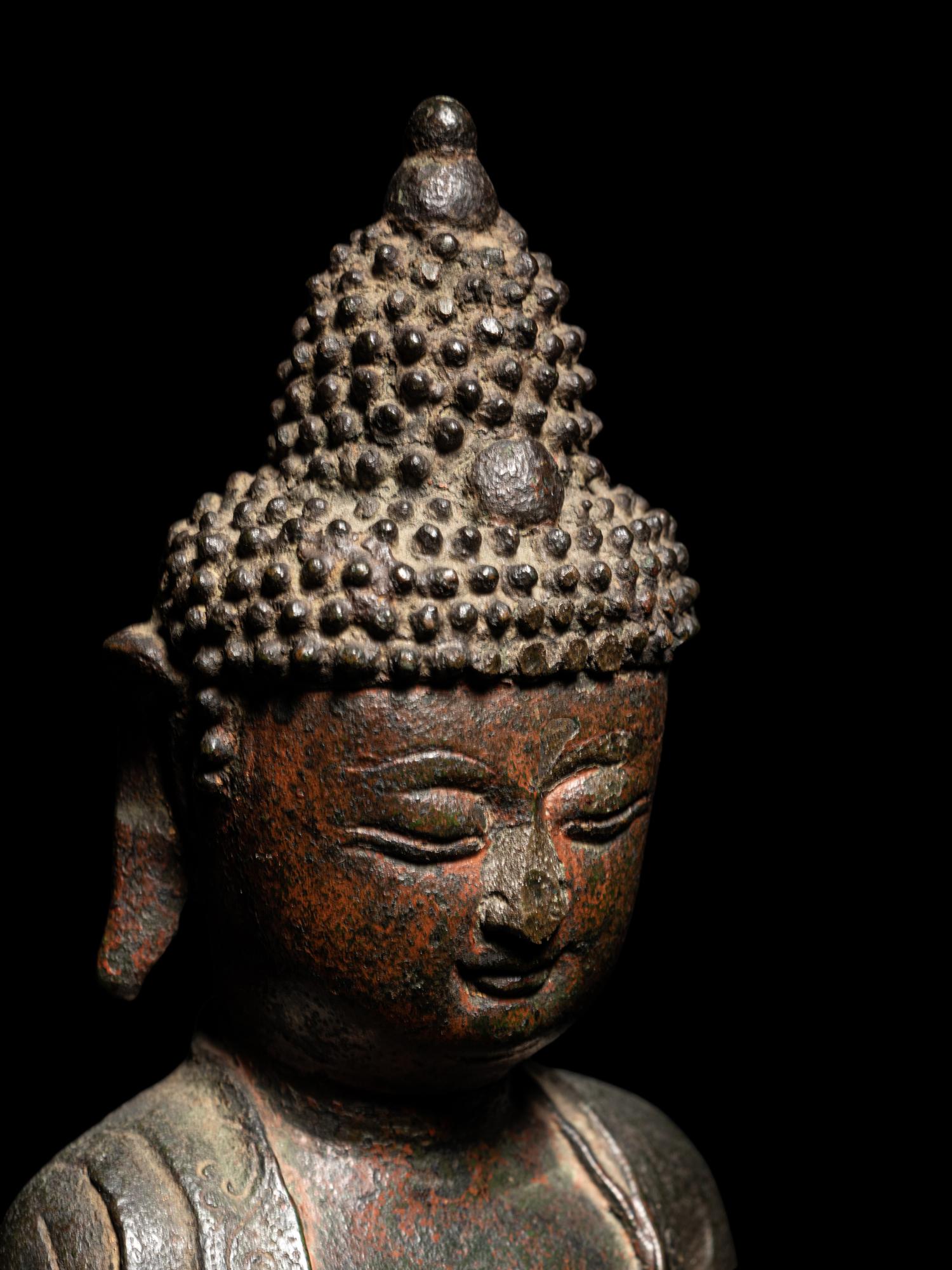 A Bronze Figure of Seated Buddha