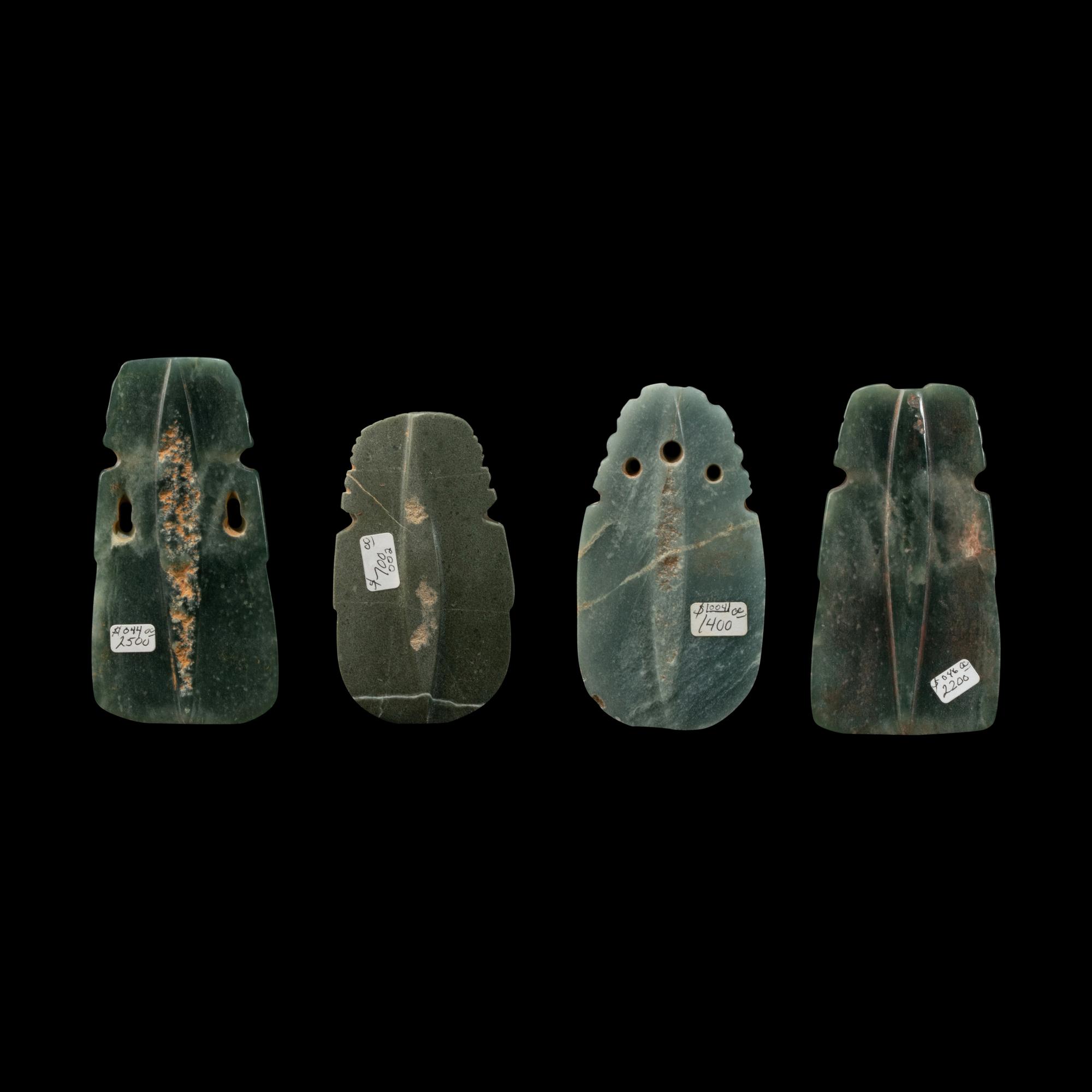 Four Costa Rican Jade Figural Celt Pendants
