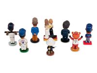 (Celebrity Memorabilia) A group of 8 bobbleheads, comprising: