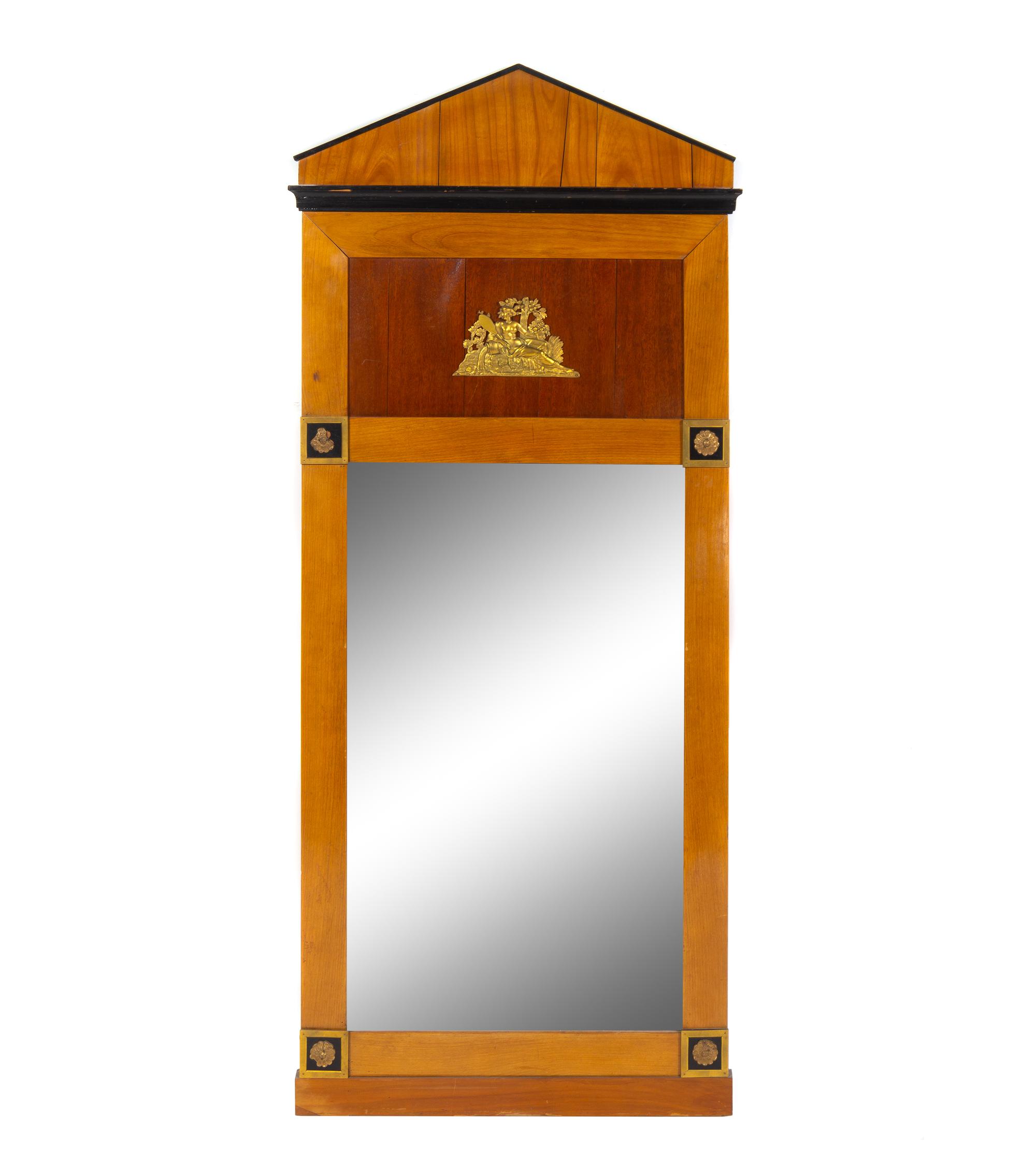 A Biedermeier Style Gilt Metal Mounted and Parcel Ebonized Mirror