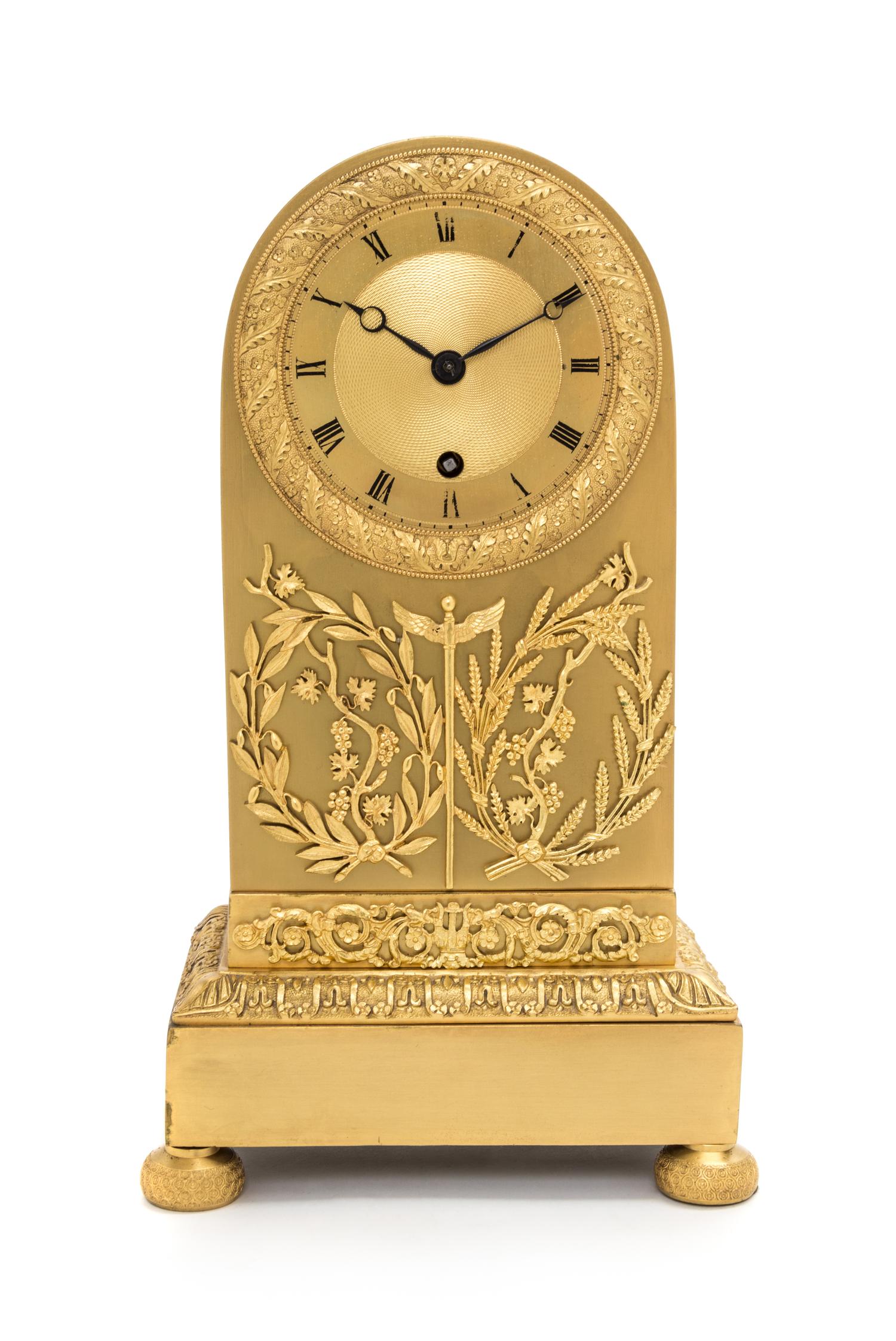 An Empire Gilt Bronze Mantel Clock Height 13 inches. — 19TH CENTURY
