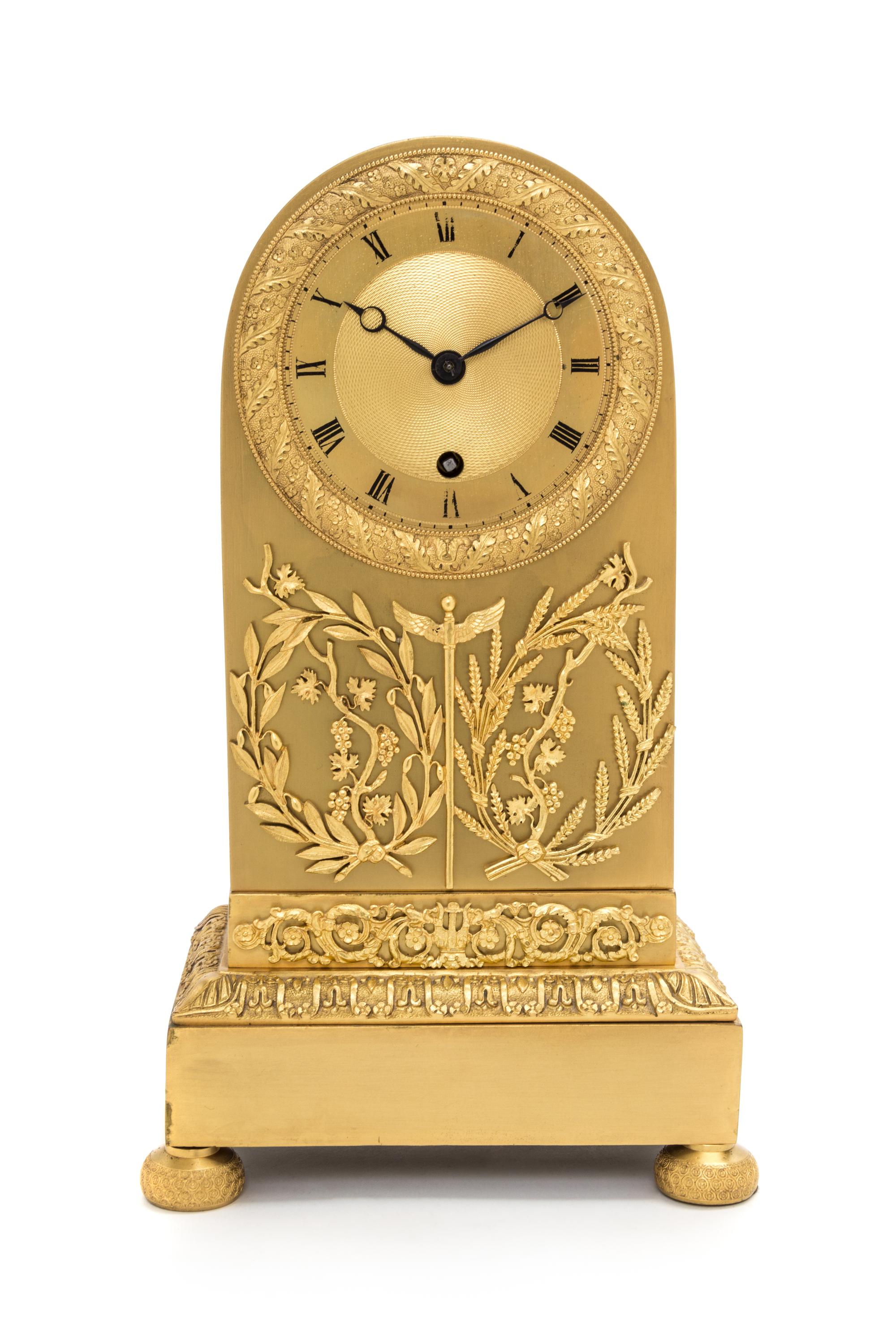 An Empire Gilt Bronze Mantel Clock Height 13 inches. — 19TH CENTURY