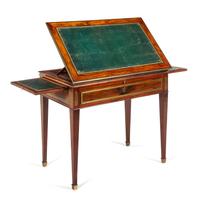 A Directoire Mahogany Drafting Table Height 29 1/2 x width 34 3/8 x depth 20 1/4 inches (closed). — CIRCA 1800