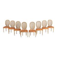 A Set of Eight Louis XVI Style Crème-Painted and Parcel Gilt Dining Chairs