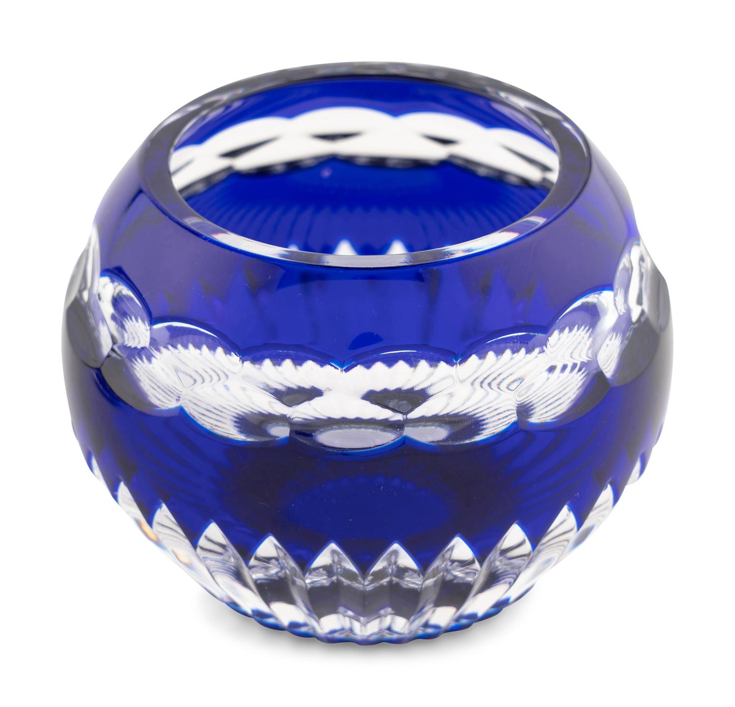 A Set of Four Modern Fabergé Blue Cut-to-Clear Glass Votive Holders and a John Hardy Silver Snuffer
