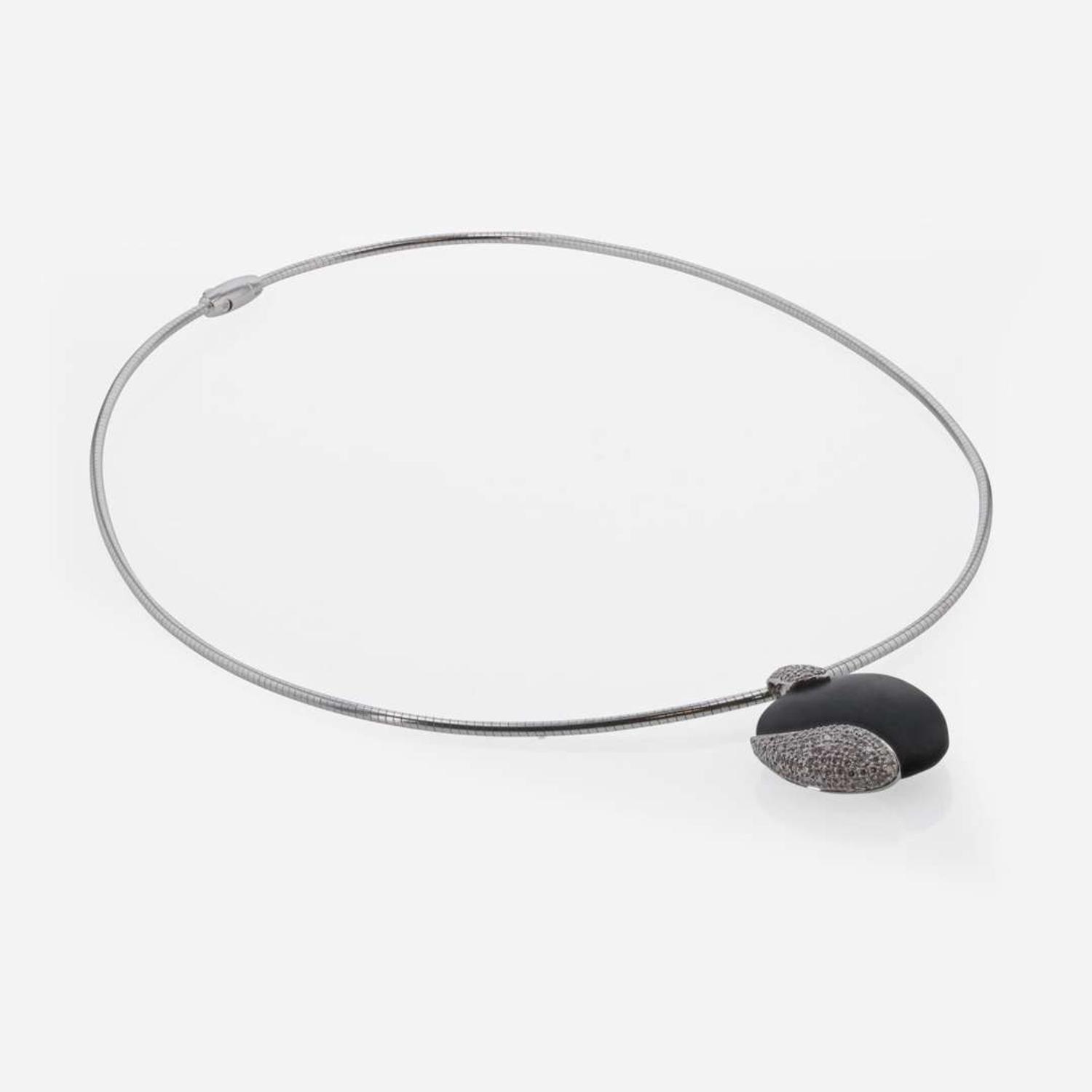 An 18K White Gold, Black Stone, and Diamond Necklace by Movado