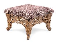 A Brass Foot Stool with Cheetah Print Upholstery