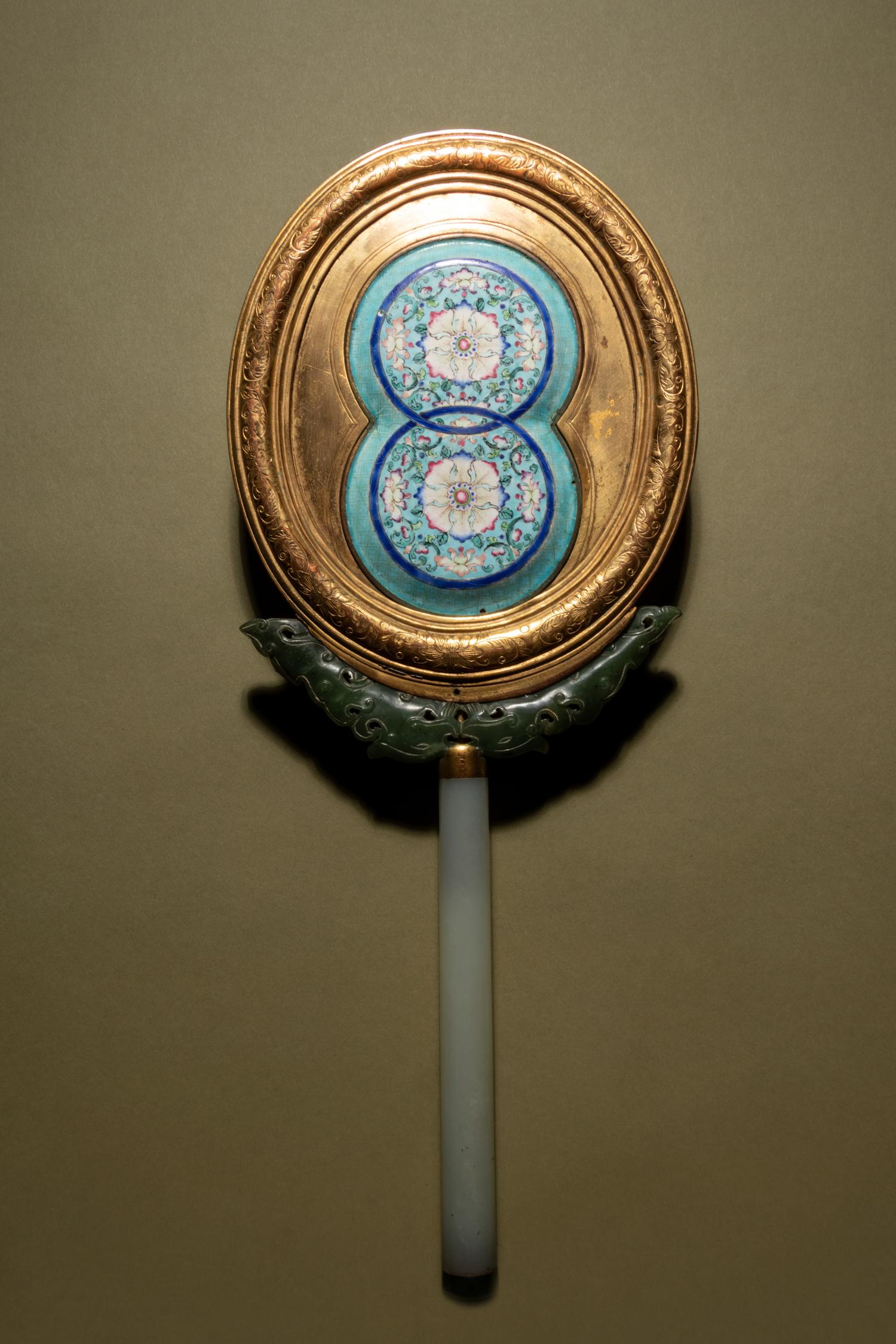 A Painted Enamel and Hardstone Mounted Gilt Metal Hand Mirror
