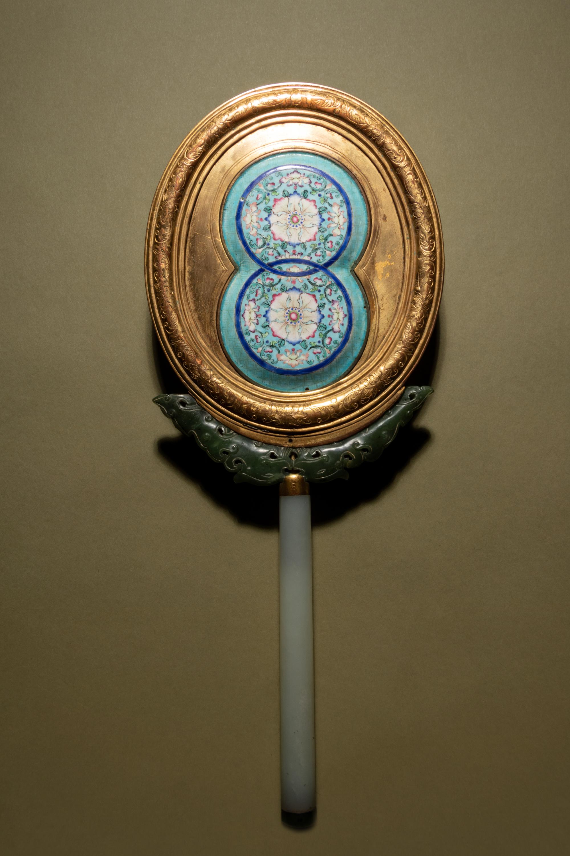 A Painted Enamel and Hardstone Mounted Gilt Metal Hand Mirror