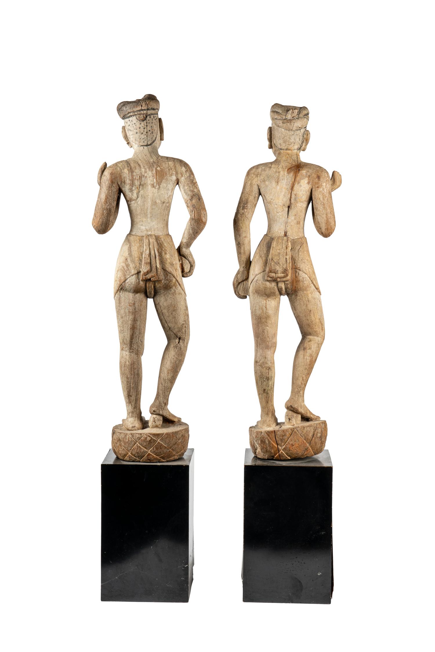 A Pair of Burmese Mandalay Carved and Painted Wood Figures