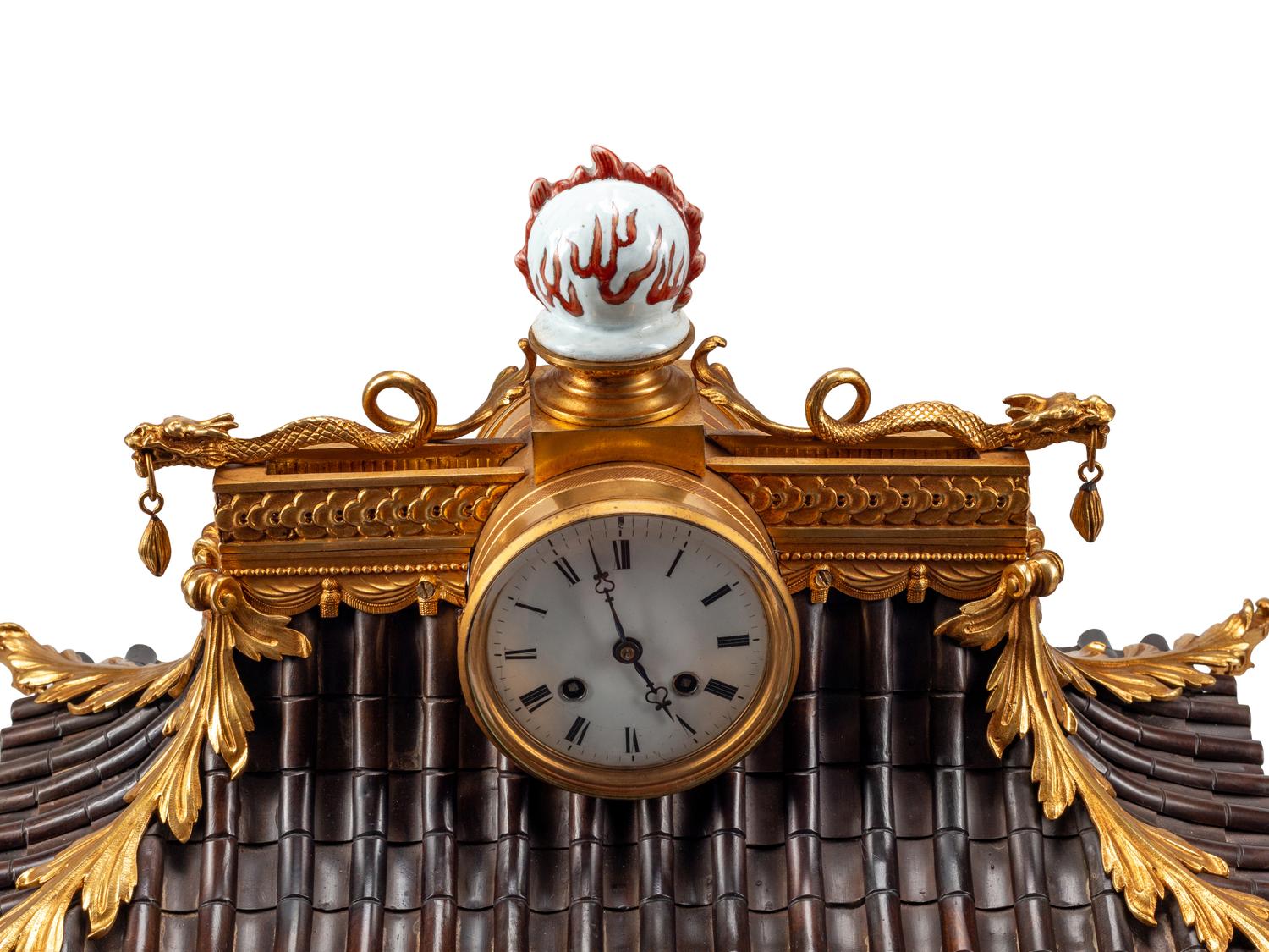 A Continental Gilt Bronze and Celadon Porcelain Figural Chinoiserie Clock