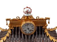 A Continental Gilt Bronze and Celadon Porcelain Figural Chinoiserie Clock