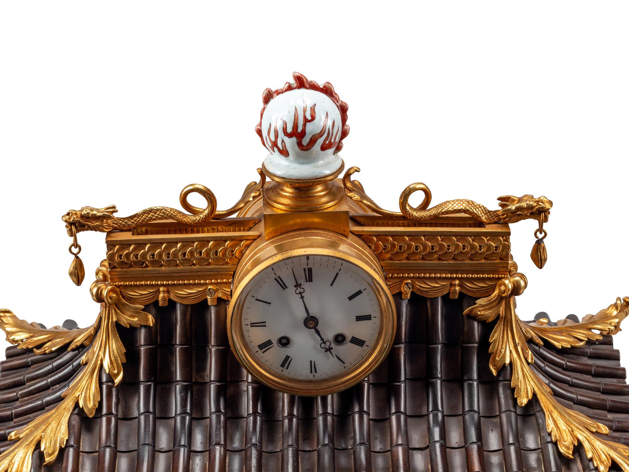 A Continental Gilt Bronze and Celadon Porcelain Figural Chinoiserie Clock