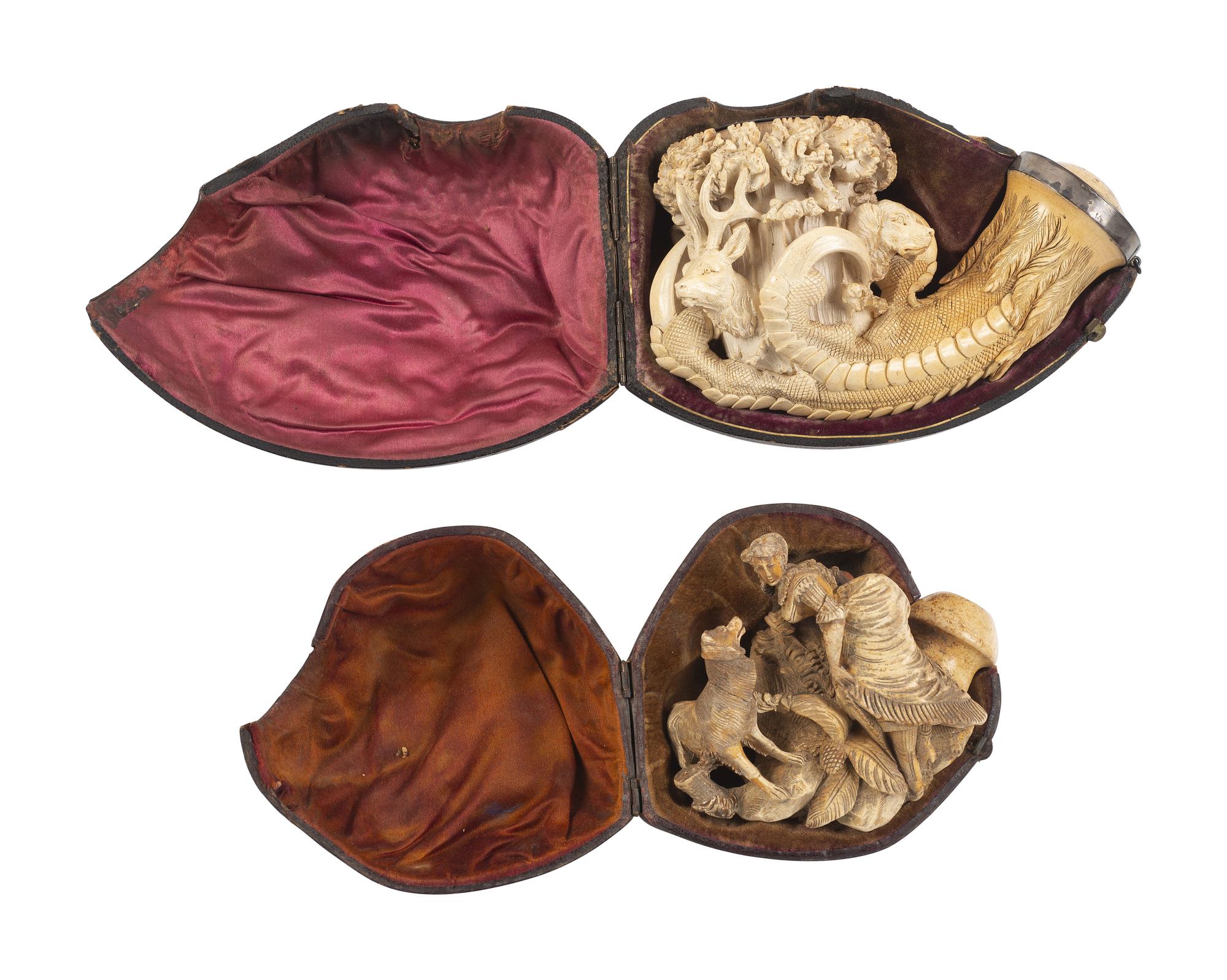 [AMERICANA - PIPES]. 2 ornately carved meerschaum pipes, each featuring animal motifs.