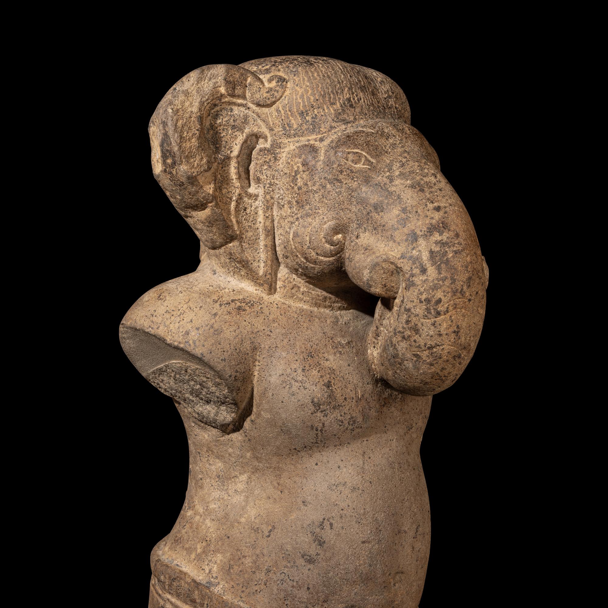 A Khmer Grey Sandstone Figure of Ganesha, Angkor Period, 10th-11th Century 十-十一世紀 吳哥窟灰沙岩象鼻天立像