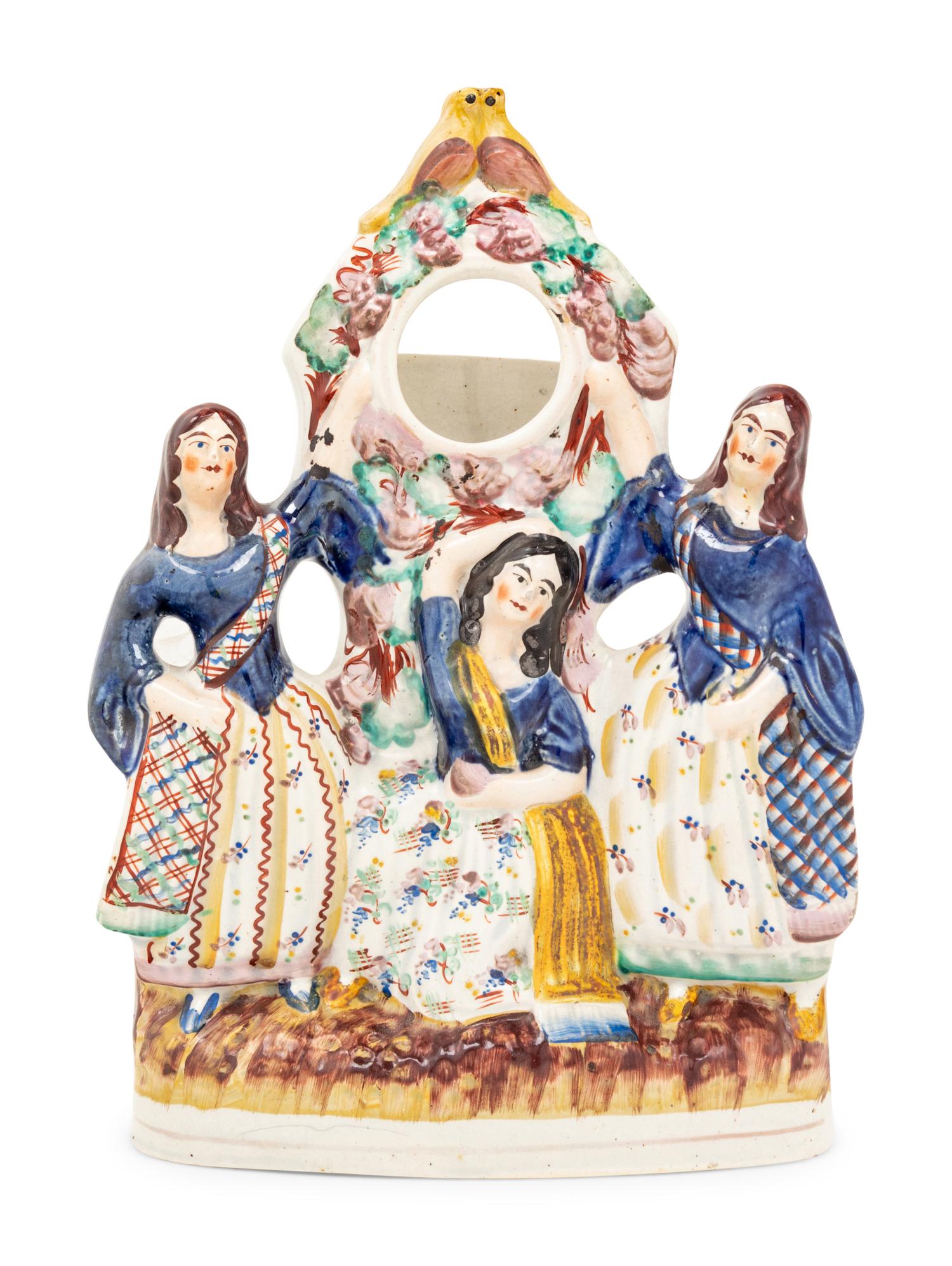 A Stafford Figural Watch Stand
