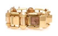A Retro 18 Karat Two Tone Gold Surprise Wristwatch, Gübelin, 103.60 dwts.