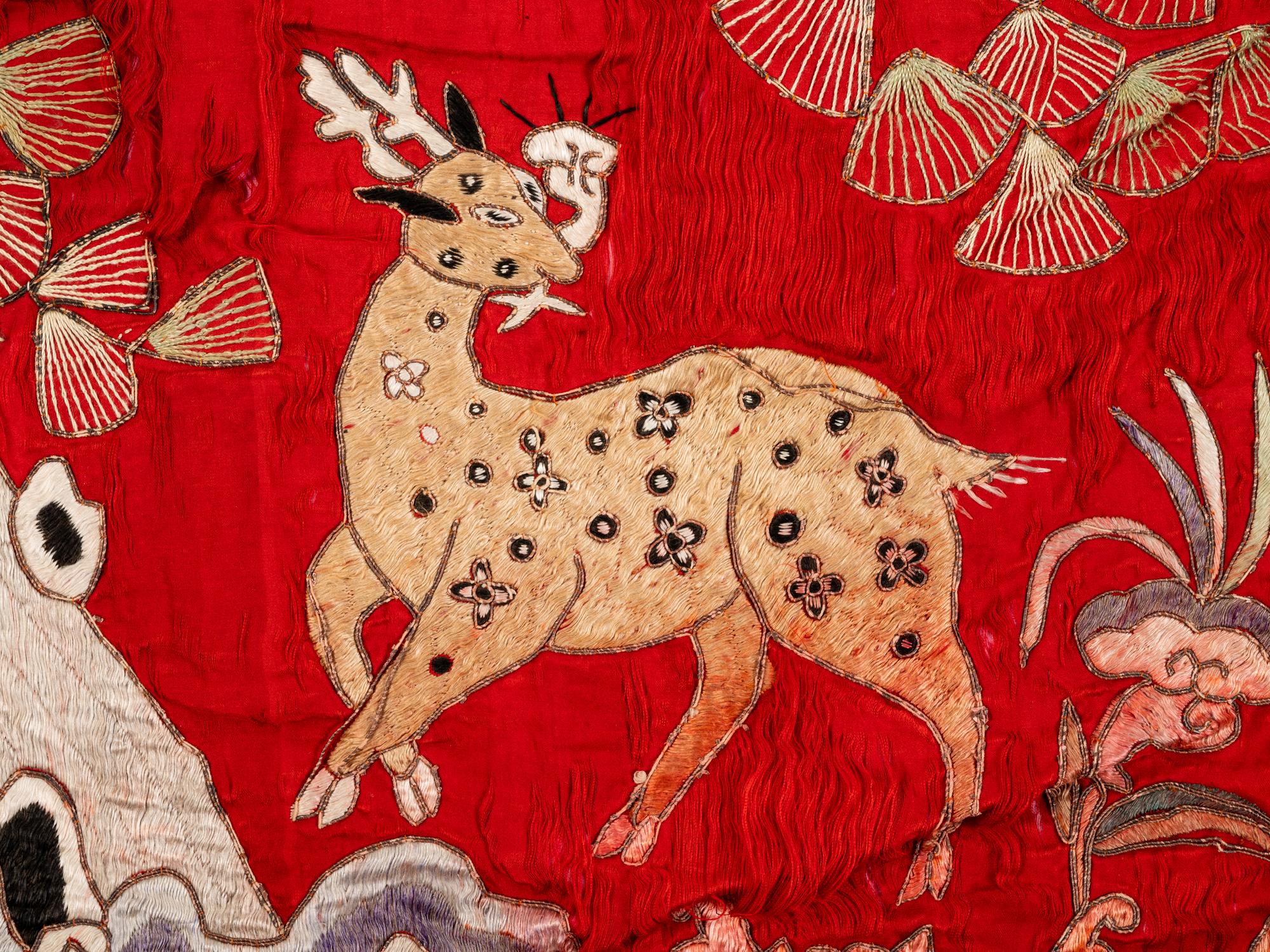 Two Chinese Red Ground Embroidered Silk 'Longevity' Panels