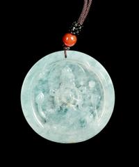 A Jadeite Pendant of Guanyin Diameter 2 1/8 inches. — 20TH CENTURY